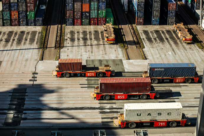 a group of trucks parked next to each other in a parking lot, train, tren, via ferret, espuela